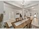 Bright dining room features a wood table with seating for four and chandelier at 8405 Sw 59Th Ter, Ocala, FL 34476