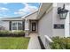 Front entryway with a walkway and landscaping at 8405 Sw 59Th Ter, Ocala, FL 34476