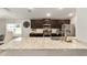 Modern kitchen with dark cabinetry, granite counters, and stainless steel appliances at 8405 Sw 59Th Ter, Ocala, FL 34476