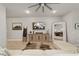 Living room with sectional sofa, large mirror, and built-in cabinet at 8405 Sw 59Th Ter, Ocala, FL 34476