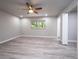 Bright bedroom with ceiling fan and wood-look floors at 8626 Sw 97Th Lane Rd # D, Ocala, FL 34481