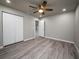 Bright bedroom with grey walls and wood-look floors at 8626 Sw 97Th Lane Rd # D, Ocala, FL 34481