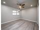 Bedroom with ceiling fan and wood-look floors at 8626 Sw 97Th Lane Rd # D, Ocala, FL 34481