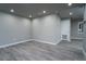 Spacious bedroom with grey walls and wood-look floors at 8626 Sw 97Th Lane Rd # D, Ocala, FL 34481