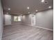 Spacious living room with light gray walls and wood-look flooring at 8626 Sw 97Th Lane Rd # D, Ocala, FL 34481