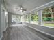 Sunroom with wood-look floors and view of backyard at 8626 Sw 97Th Lane Rd # D, Ocala, FL 34481