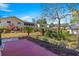 Landscaped backyard with patio and rock wall at 8637 Sw 97Th Lane Rd # A, Ocala, FL 34481