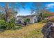 Backyard view of home, landscaping and trees at 8637 Sw 97Th Lane Rd # A, Ocala, FL 34481