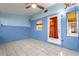 Sunroom with light blue walls and tiled floor at 8637 Sw 97Th Lane Rd # A, Ocala, FL 34481