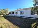 House exterior showcasing backyard and sunroom at 8697 Se 136Th Ln, Summerfield, FL 34491