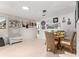 A well-lit dining area featuring a rustic bench and wall art at 8738 Sw 90Th St # B, Ocala, FL 34481