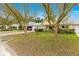 Attractive yellow house with a well-manicured lawn and mature trees at 8738 Sw 90Th St # B, Ocala, FL 34481