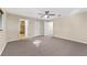 Large bedroom with wall-to-wall carpet and en-suite bathroom at 8750 Sw 91St Pl # A, Ocala, FL 34481