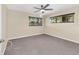 Bright bedroom featuring ceiling fan and neutral carpeting at 8750 Sw 91St Pl # A, Ocala, FL 34481