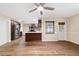 Open concept dining area with hardwood floors and kitchen view at 8750 Sw 91St Pl # A, Ocala, FL 34481