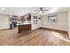 Open concept dining area with hardwood floors and kitchen island at 8750 Sw 91St Pl # A, Ocala, FL 34481