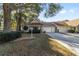 Front view of a charming villa nestled in a tree-lined neighborhood at 8750 Sw 91St Pl # A, Ocala, FL 34481