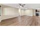 Spacious living room with wood-look flooring and elegant wainscoting at 8750 Sw 91St Pl # A, Ocala, FL 34481