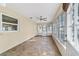 Relaxing sunroom with tile flooring and ceiling fan at 8750 Sw 91St Pl # A, Ocala, FL 34481