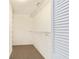 Spacious walk-in closet with wire shelving and ample hanging space at 8750 Sw 91St Pl # A, Ocala, FL 34481