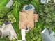Aerial view of a beautiful home with mature landscaping and a sparkling blue pool at 8990 Se 178Th Muirfield Pl, The Villages, FL 32162