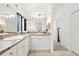 Bathroom with a long double sink vanity and a large mirror at 8990 Se 178Th Muirfield Pl, The Villages, FL 32162