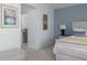 Bedroom with a queen bed and access to a walk-in closet at 8990 Se 178Th Muirfield Pl, The Villages, FL 32162