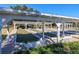Bocce ball court with multiple lanes, benches, and a covered pergola for shade, adding to the community's recreational amenities at 8990 Se 178Th Muirfield Pl, The Villages, FL 32162