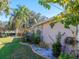 Landscaped yard with a view of the home's exterior at 8990 Se 178Th Muirfield Pl, The Villages, FL 32162