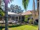 Home's exterior boasts a pool and lush landscaping at 8990 Se 178Th Muirfield Pl, The Villages, FL 32162