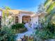 Well-maintained house exterior with lush landscaping at 8990 Se 178Th Muirfield Pl, The Villages, FL 32162