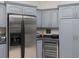 Kitchen features stainless steel appliances and wine cooler at 8990 Se 178Th Muirfield Pl, The Villages, FL 32162