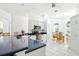 Bright kitchen area featuring modern appliances, countertop and seating area, adjacent to the dining area at 8990 Se 178Th Muirfield Pl, The Villages, FL 32162