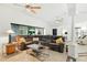 Bright living room with tiled floors, ceiling fans and a comfortable sectional sofa at 8990 Se 178Th Muirfield Pl, The Villages, FL 32162