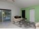 Living room with cream sofa, coffee table, and view of the pool area at 8990 Se 178Th Muirfield Pl, The Villages, FL 32162