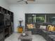 Living room with sectional sofa, coffee table, and view of the backyard at 8990 Se 178Th Muirfield Pl, The Villages, FL 32162