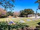 Outdoor shuffleboard courts in a community offering an engaging recreational activity amid a beautifully maintained green space at 8990 Se 178Th Muirfield Pl, The Villages, FL 32162