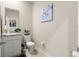 Modern powder room with granite countertop and single sink at 9181 Sw 49Th Ct, Ocala, FL 34476