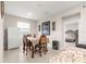 Bright dining area with table and chairs, adjacent to kitchen at 9181 Sw 49Th Ct, Ocala, FL 34476