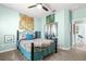 Bedroom with patterned bedding, and mirrored closet doors at 9470 Sw 66Th Loop, Ocala, FL 34481