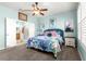 Bedroom with teal walls, a queen bed, and en-suite bathroom access at 9470 Sw 66Th Loop, Ocala, FL 34481