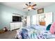 Bedroom with white dresser, queen bed, and en-suite bathroom at 9470 Sw 66Th Loop, Ocala, FL 34481