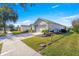 Side view of house showcasing garage and landscaping at 9470 Sw 66Th Loop, Ocala, FL 34481