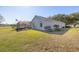 House with screened patio and American flag, overlooking golf course at 9554 Sw 93Rd Loop, Ocala, FL 34481