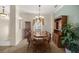 Bright dining room with wooden table and chairs at 9554 Sw 93Rd Loop, Ocala, FL 34481