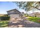 One-story house featuring a paved driveway and neatly trimmed hedges at 9554 Sw 93Rd Loop, Ocala, FL 34481