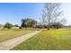 Pathway meanders through a tranquil golf course landscape at 9554 Sw 93Rd Loop, Ocala, FL 34481