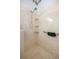 Walk-in shower with grab bars and built-in shelving at 9554 Sw 93Rd Loop, Ocala, FL 34481