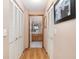 Clean hallway with built in closets leading to bathroom at 9802 Sw 88Th Ter # A, Ocala, FL 34481