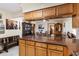 Spacious kitchen featuring wood cabinets and granite countertops at 9802 Sw 88Th Ter # A, Ocala, FL 34481